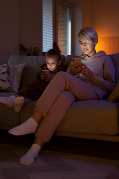 Child and parent suffering from social media addiction