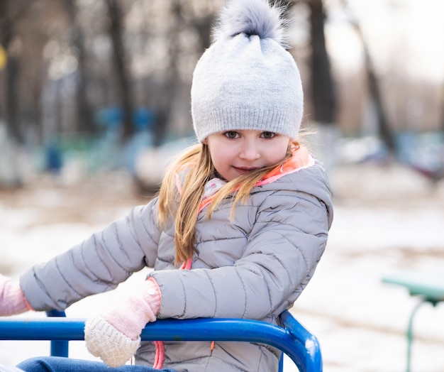 Child plating at playground toys