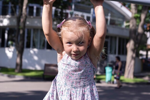 Child on the playground on a summer day. Real people.