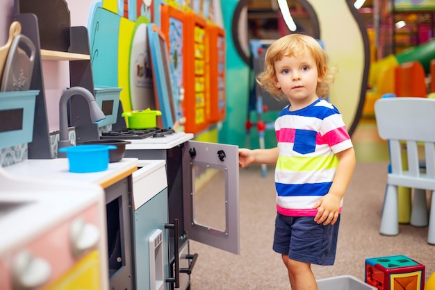 Child playing with colorful toys at the learning center or in kindergarten