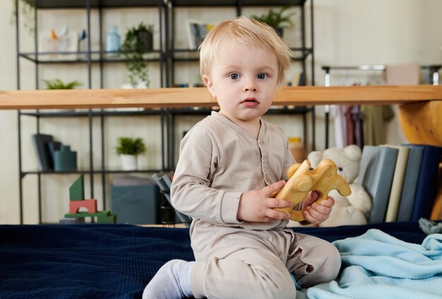 Child playing with toy at home