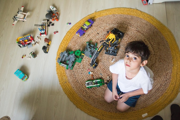 Child playing with toys at home in lockdown
