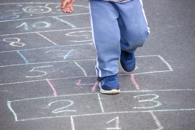 Photo child plays classics in the open air playground