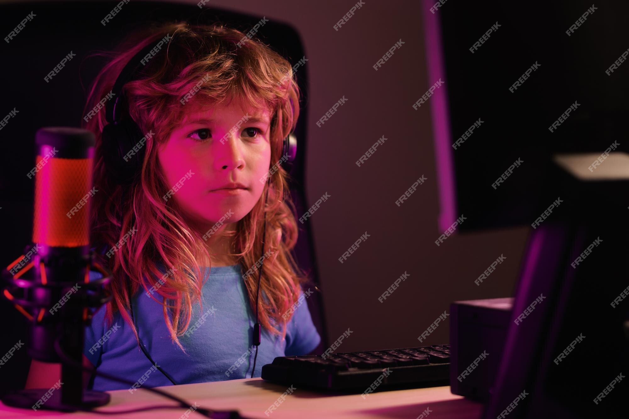 Premium Photo  Child plays a video game on the pc computer screen school  study online learning concept gamer play computer games neon lighting