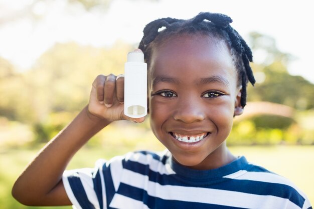 Child posing with an object