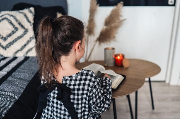 Child pray and read Bible in his room religious concept