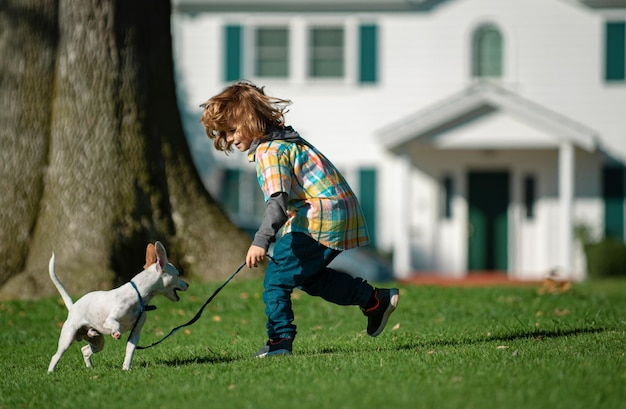 Child and puppy best friends kid boy and puppy rest and have fun on vacation happy childhood