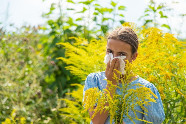 Child in ragweed flowers allergy Selective focus