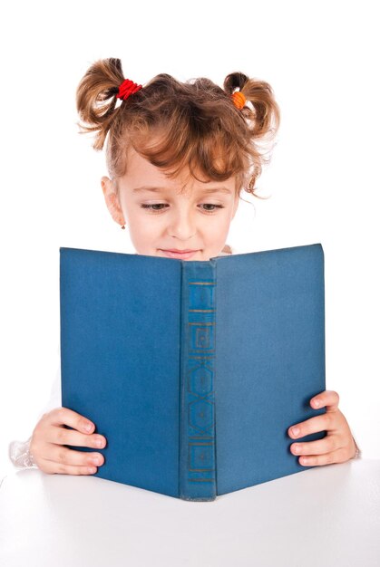 Child reading book isolated on a white background