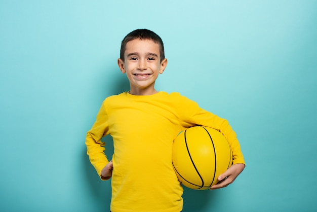 Child ready to play at basketball