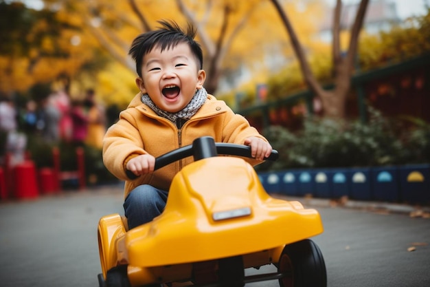 a child rides a yellow toy car in the park