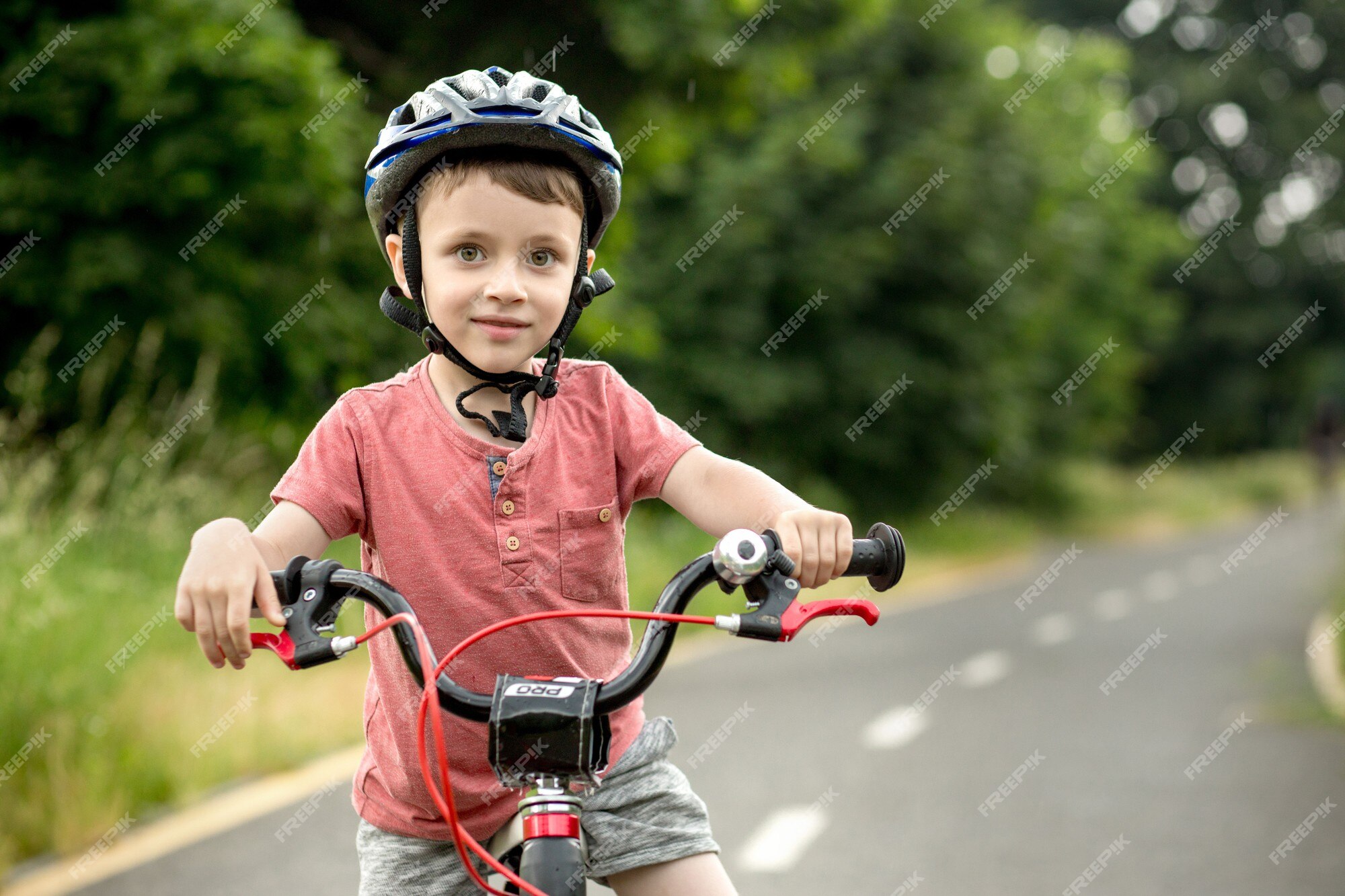 Happy Little Boy Riding a Bike Stock Image - Image of lifestyle