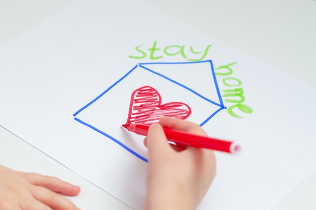 Child's hand drawing heart