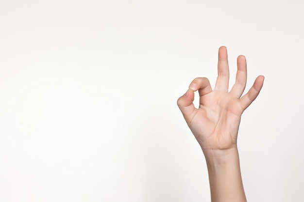 Child's hand showing gesture The child's hand is holding something Isolated on white background