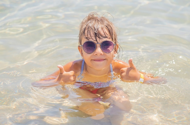 Child at sea resting. Journey