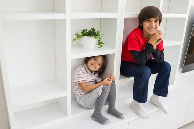 Child in shelf inside living room