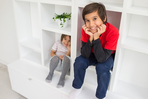 Child in shelf inside living room