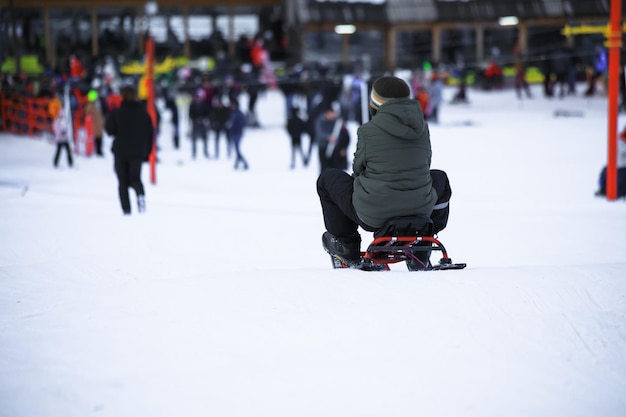 Child sitting on sled