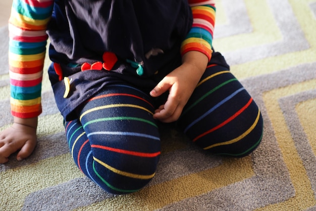 Child sitting W posture on the floor