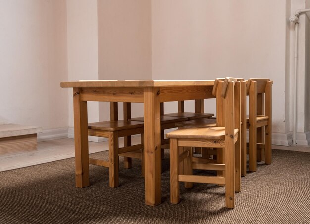 Child sized table and six chairs in classroom