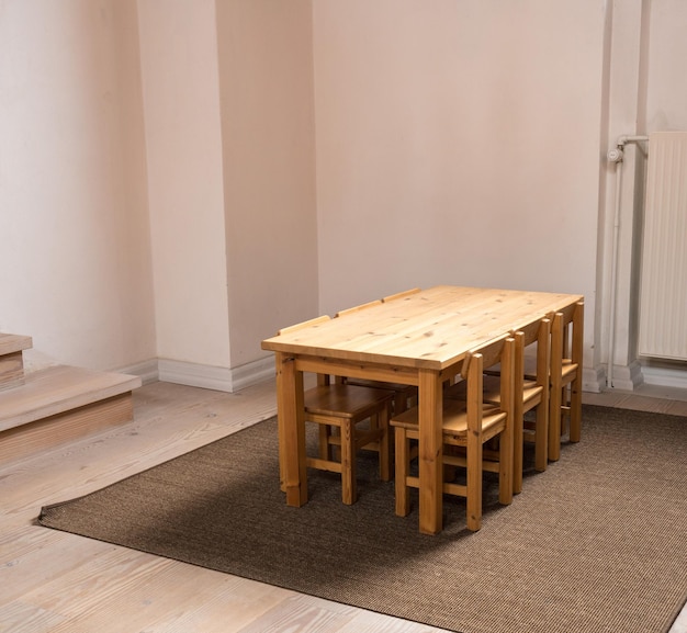 Child sized table and six chairs in classroom