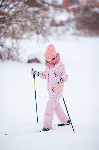 Child skiing in the mountains. Winter sport for kids.