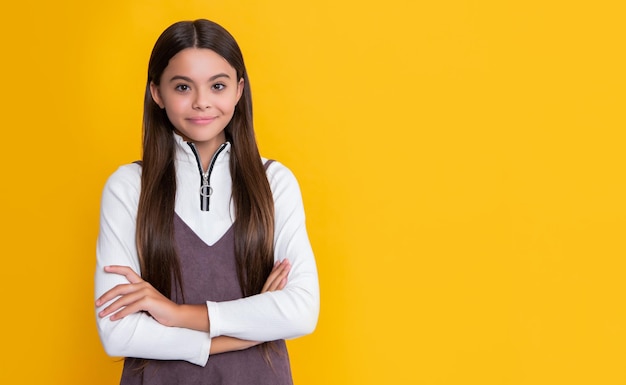 Child smile with long hair on yellow background