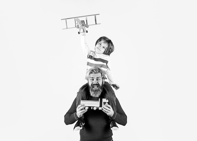 Child son pilot and dad father with airplane