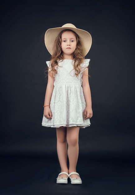 The child in the Studio posing in fashionable clothes