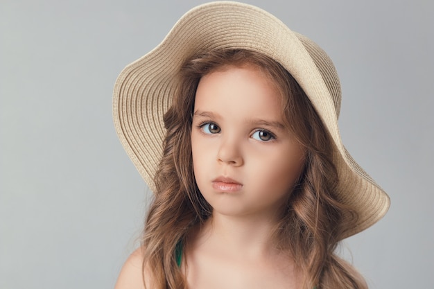 The child in the Studio posing in fashionable clothes