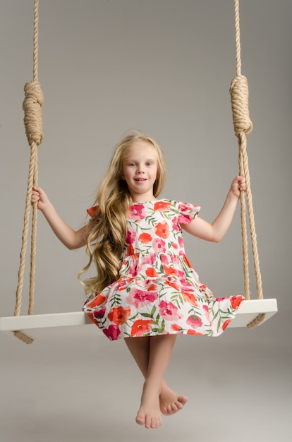 The child in the Studio posing in fashionable clothes