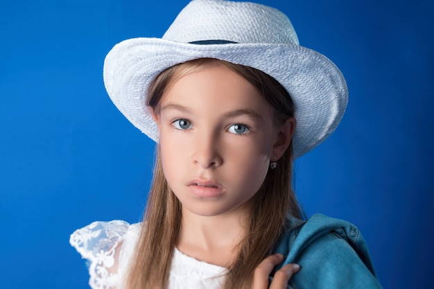 Child in the Studio posing in fashionable clothes