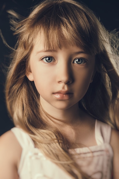 The child in the Studio posing in fashionable clothes