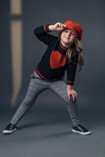 The child in the Studio posing in fashionable clothes