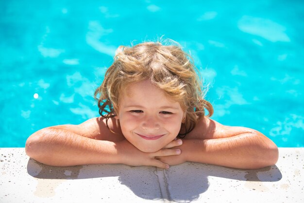 Child in summer swimming pool kid relax outdoors summer vacation and healthy lifestyle concept