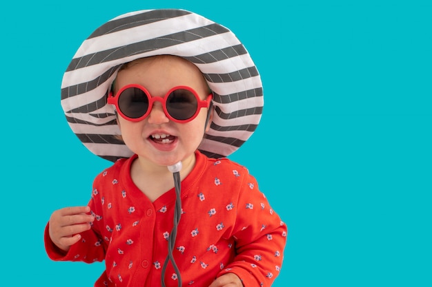 Child in sunglasses and hat