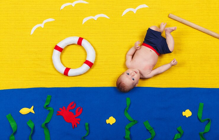 Child swimming under water. Learning infant child to swim. Summer