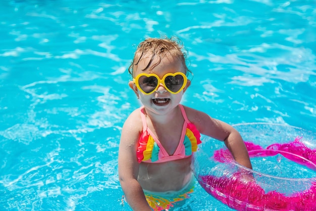 A child swims in a pool with a circle Selection focus