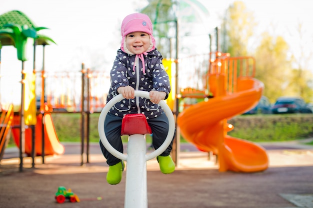 Child on a swing in the spring