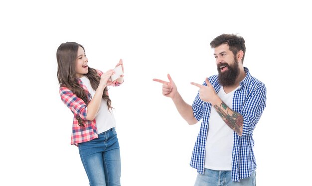 Child take photo of bearded man on cell phone Using mobile phone as camera