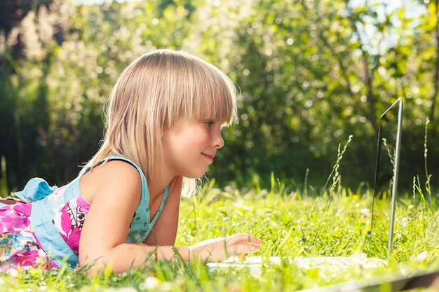 Photo child using a laptop homeschooling during selfisolation