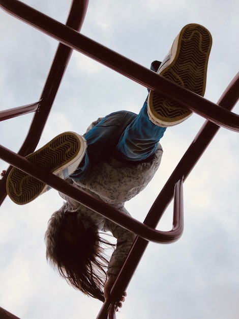 Child walking on ladder in the playground