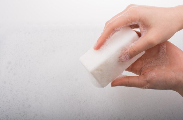 Child washing hands with soap