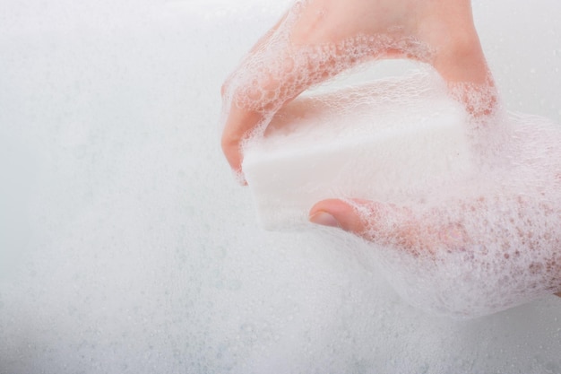 Child washing hands with soap