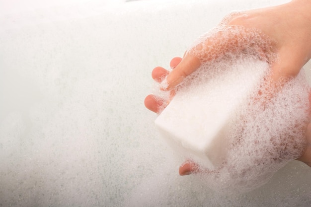 Child washing hands with soap