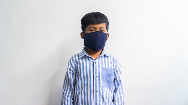 A child wears a mask because he is coughing, sneezing and flu