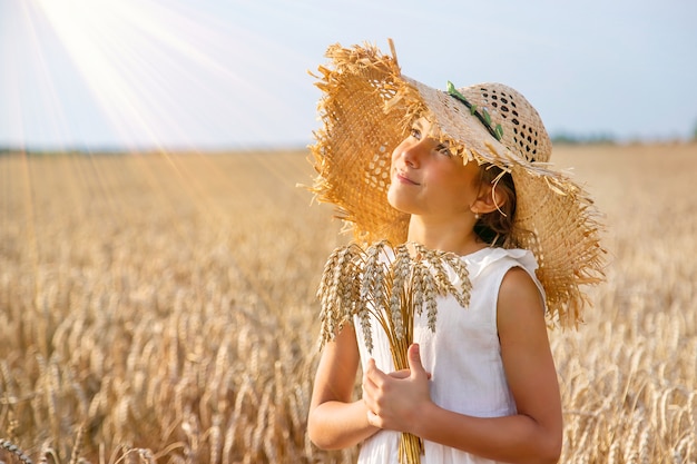 A child in a wheat field. Selective focus.