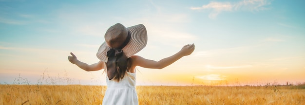 A child in a wheat field.  