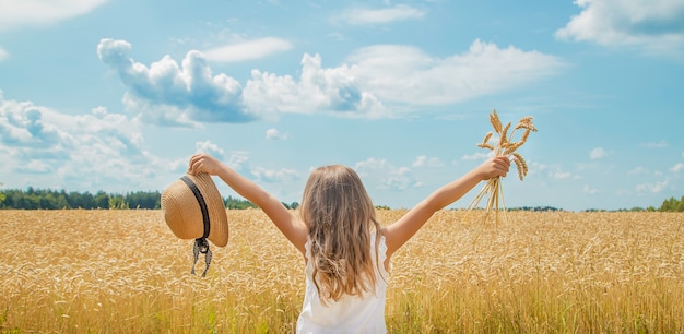 A child in a wheat field.