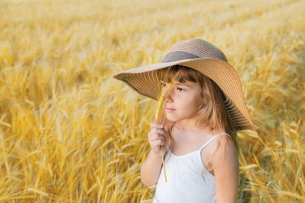 A child in a wheat field.